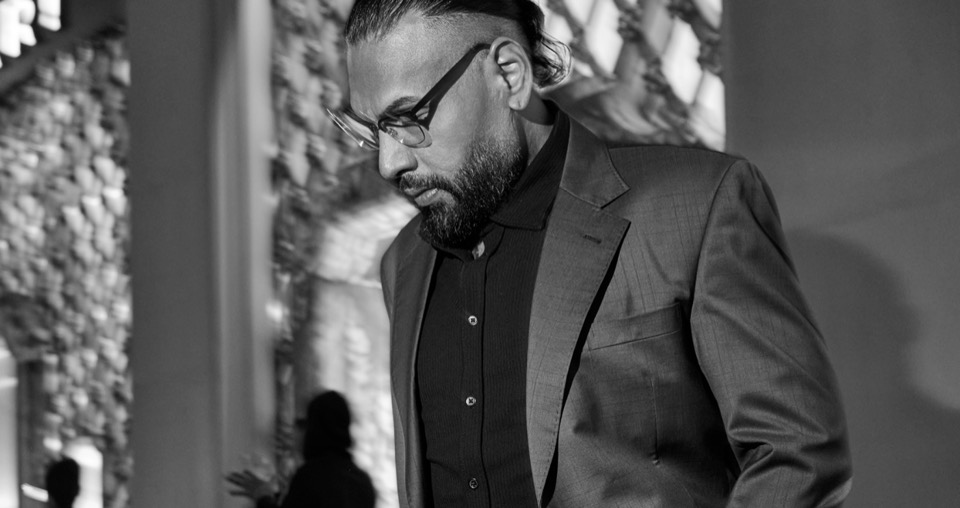 Jas Mathur in a dark suit, photographed in black and white
